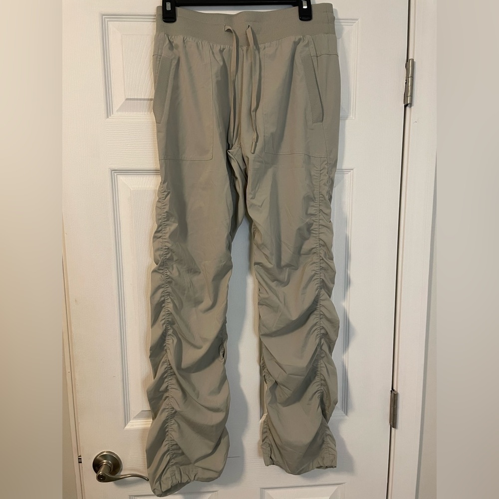 scrunched windbreaker tan pants